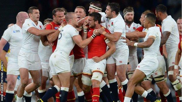 England full-back Mike Brown and Wales captain Sam Warburton scuffle during the World Cup game at twickenham