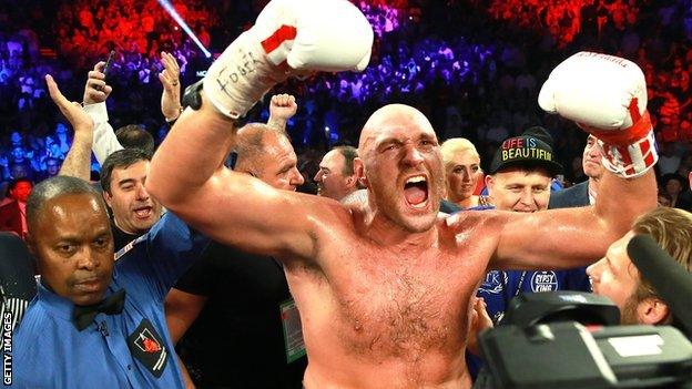 Tyson Fury celebrates after his second round win