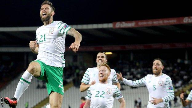 Daryl Murphy celebrates after equalising in Belgrade