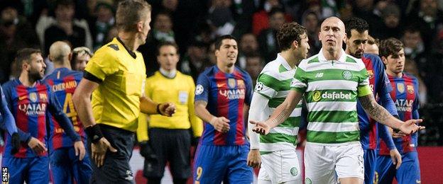 Scott Brown appeals to referee Daniele Orsato after he awarded Barcelona a penalty for Emilio Izaguirre's challenge on Luis Suarez