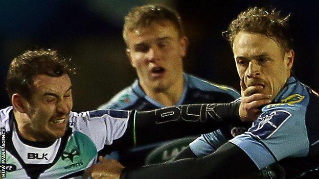 Ospreys' Tom Grabham hands off Corry Allen in November, 2016