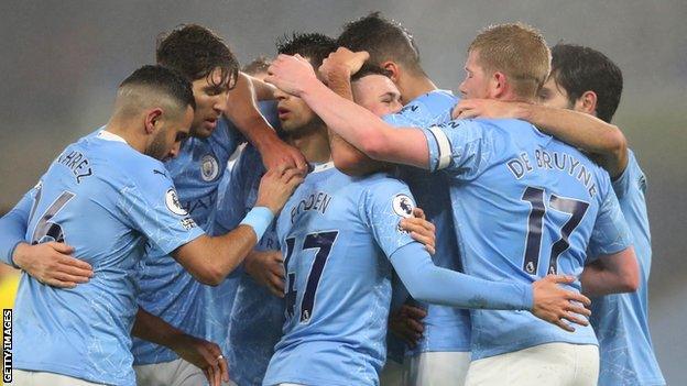 Manchester City celebrate scoring against Brighton