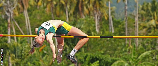 Woman competes in a high jump competition