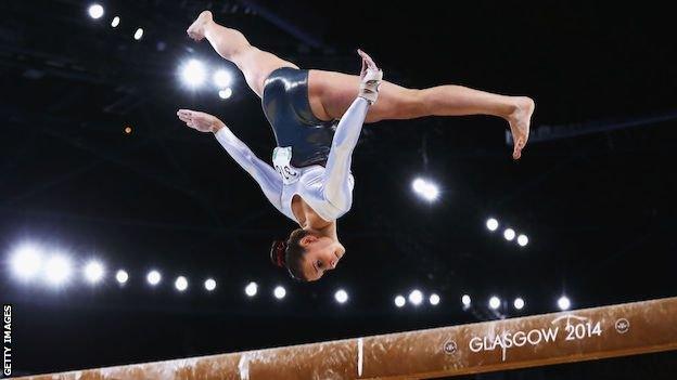 Hannah Whelan competing at the 2014 Commonwealth Games on the beam