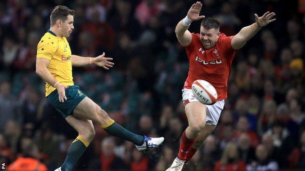 Wales prop Rob Evans puts pressure on Australia fly-half Bernard Foley