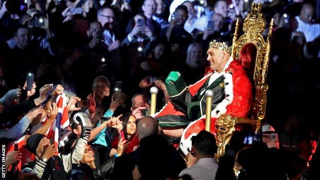 Tyson Fury is carried to the ring on a throne before his heavyweight bout against Deontay Wilder