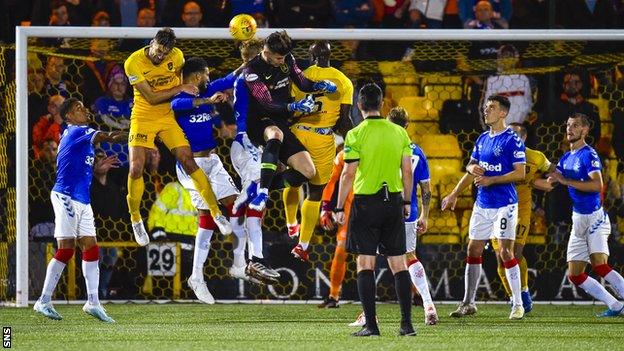 Rangers are through to their fourth consecutive League Cup semi-final after a bruising tie