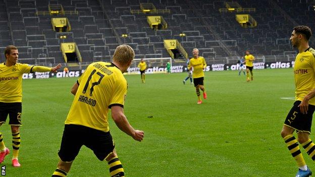 Dortmund players observed social distancing protocol as they celebrated Haaland's goal