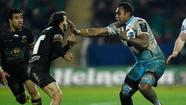 Leone Nakarawa of Glasgow Warriors hands off Lee Dickson of Northampton Saints