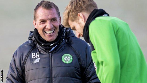 Brendan Rodgers shares a joke with Stuart Armstrong at training on Monday morning