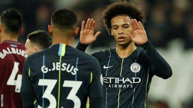 Leroy Sane celebrates with Manchester City team-mate Gabriel Jesus