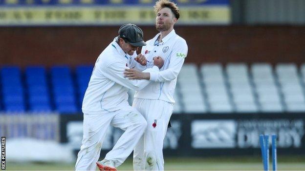 Wayne Madsen helped Derbyshire's Matt Critchley celebrate only his third five-wicket haul for the county