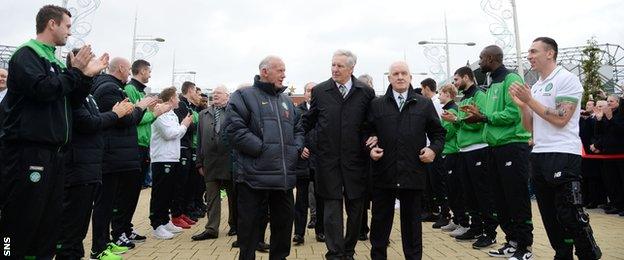 Billy McNeill is applauded by Celtic's players and management