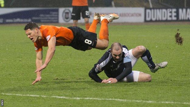 James McPake (right) challenges John Rankin