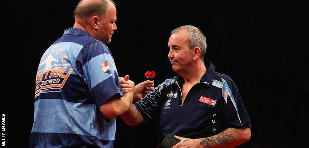 Raymond van Barneveld shakes hands with Phil Taylor