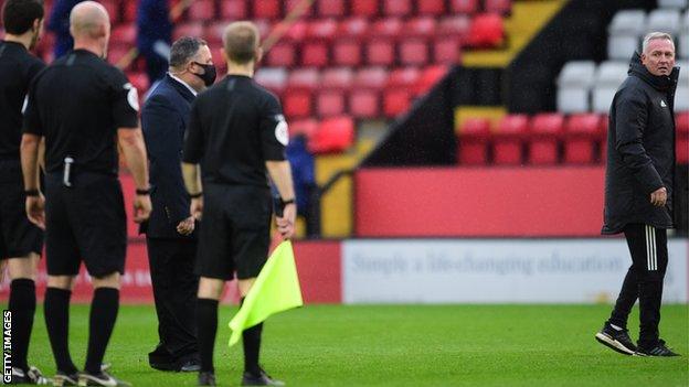 Ipswich Town manager Paul Lambert speaks to Referee Kevin Johnson following defeat by Lincoln