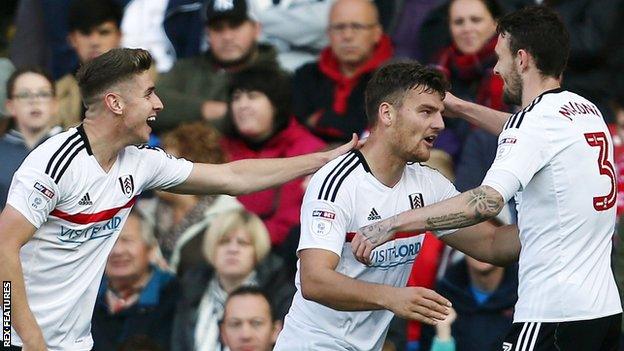 Chris Martin (centre) celebrates scoring for Fulham