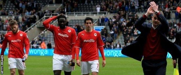 Cardiff manager Ole Gunnar Solskjaer applauds his relegated side's fans after the final whistle