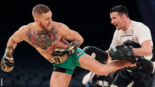 Conor McGregor in training with striking coach Owen Roddy