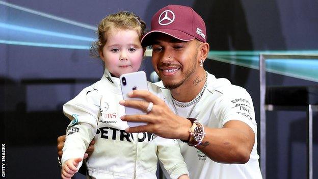 Lewis Hamilton and a young fan