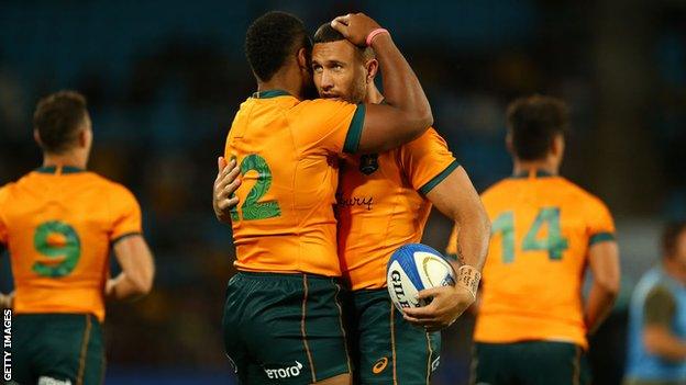 Samu Kerevi and Quade Cooper of Australia