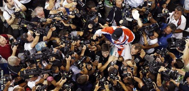 Lewis Hamilton was surrounded by photographers after winning the Abu Dhabi GP in 2014