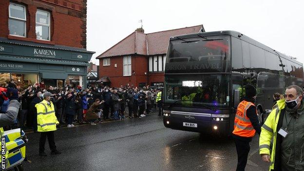 Fans wait for Marine coach