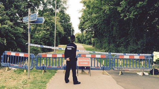 Closed footpath with policeman