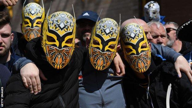 Wolves fans wear masks of Mexican WWE wrestler Sin Cara