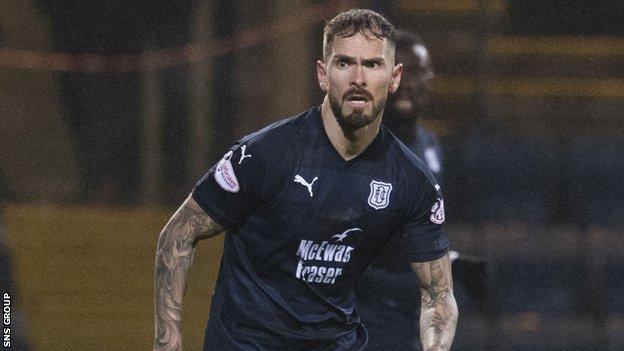 Martin Woods is staying at Dens Park