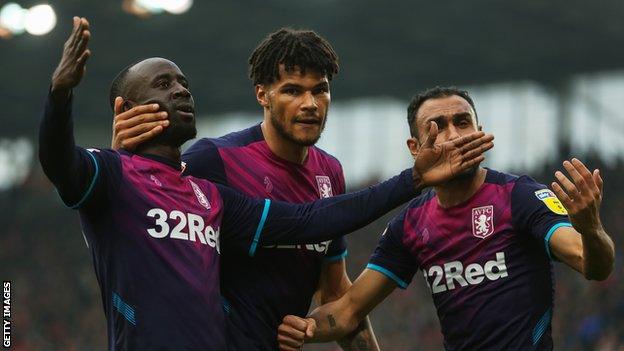 Albert Adomah, Tyrone Mings and Ahmed Elmohamady celebrate Aston Villa's equaliser at Stoke City