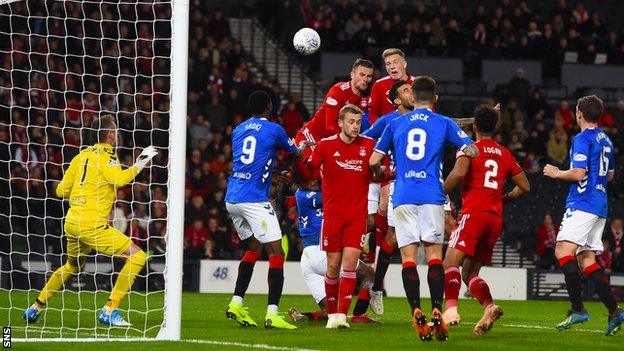 Lewis Ferguson scores