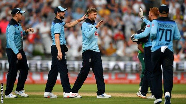 Joe Root celebrates with team-mates in South Africa