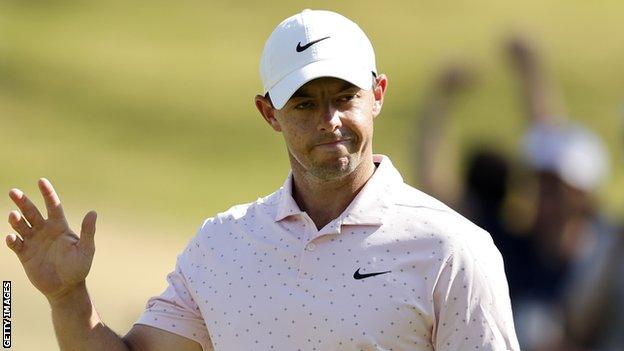 A rueful Rory McIlroy acknowledges applause during his tied match with Cameron Smith on Friday