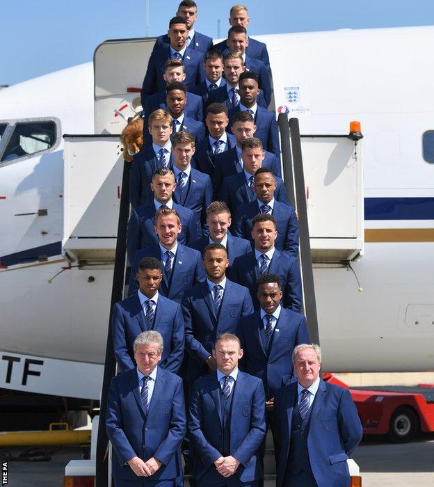 The full 23-man England squad and management team prepare to board their plan to France for Euro 2016