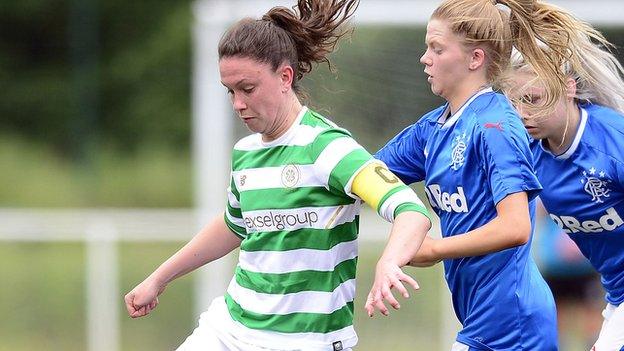 Celtic captain Kelly Clark holds of Brogan Hay of Rangers