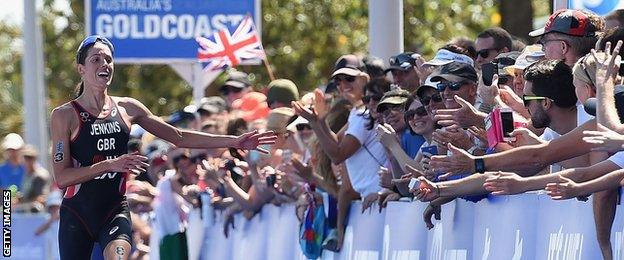 Helen Jenkins is cheered on by the crowd at the Gold Coast triathlon