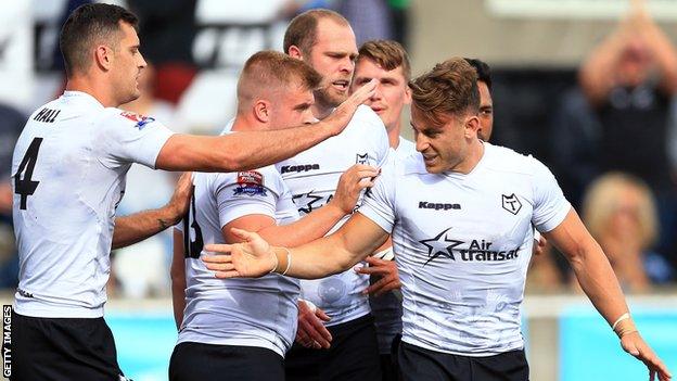 Toronto Wolfpack players celebrating a try