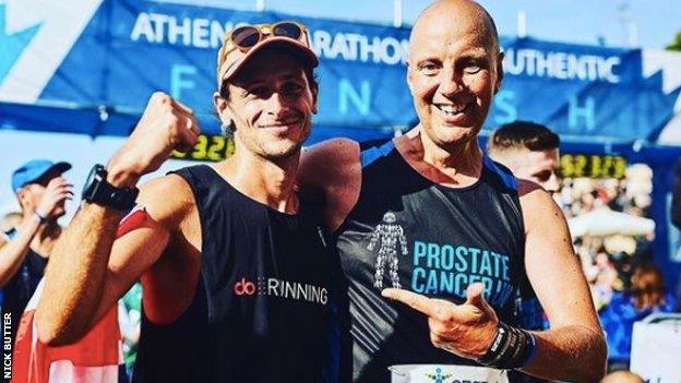 Left to right: Nick Butter and Kevin Webber, celebrating at the finish line of the Athens marathon.