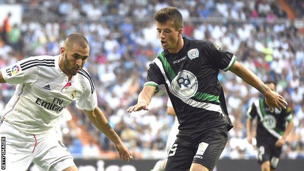 Daniel Pinillos (right) in action against Real Madrid's Karim Benzema