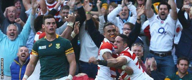 Japan players celebrate their winning try against South Africa