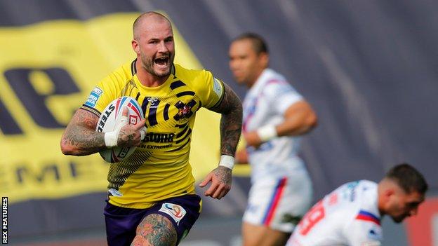 Zak Hardaker runs in a try for Wigan