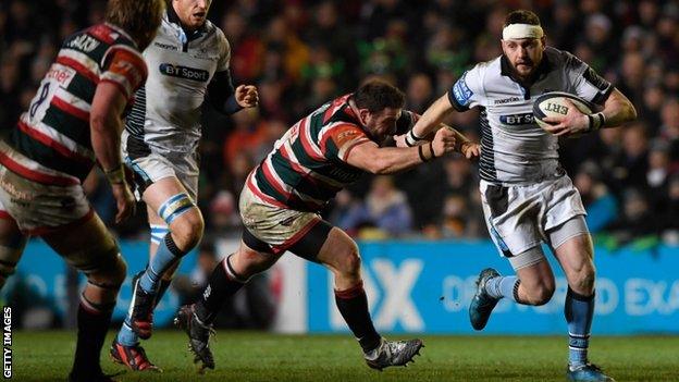 Glasgow fly-half Finn Russell takes on the Leicester defence