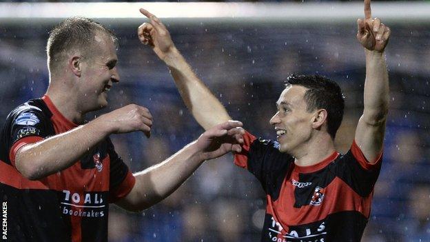 Jordan Owens congratulates a delighted Paul Heatley after the winger scores against Linfield