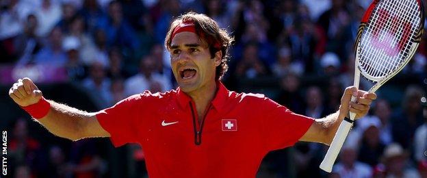 Roger Federer celebrates beating Juan Martin Del Potro at the Olympics