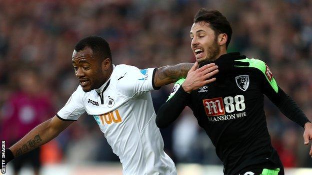 Jordan Ayew of Swansea City and Adam Smith of AFC Bournemouth