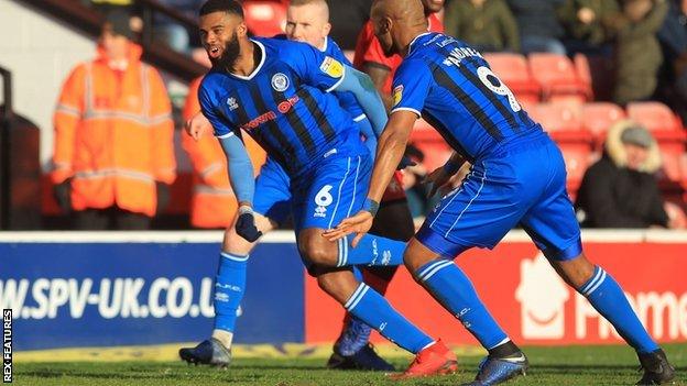 Ethan Ebanks-Landell (left) celebrates scoring for Rochdale