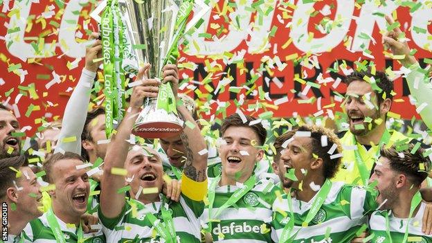 Celtic captain Scott Brown lifts the Scottish Premiership trophy