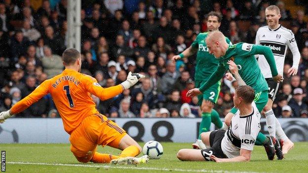 Alfie Mawson challenges Will Hughes