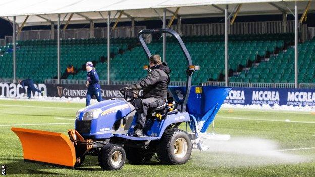 A tractor on the Scotstoun Stadium pitch